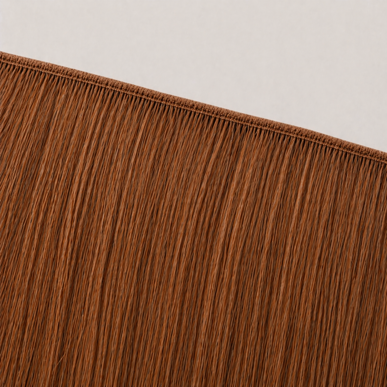 Flat butterfly weft seam of Stessia hair extensions in shade #30 Warm Copper