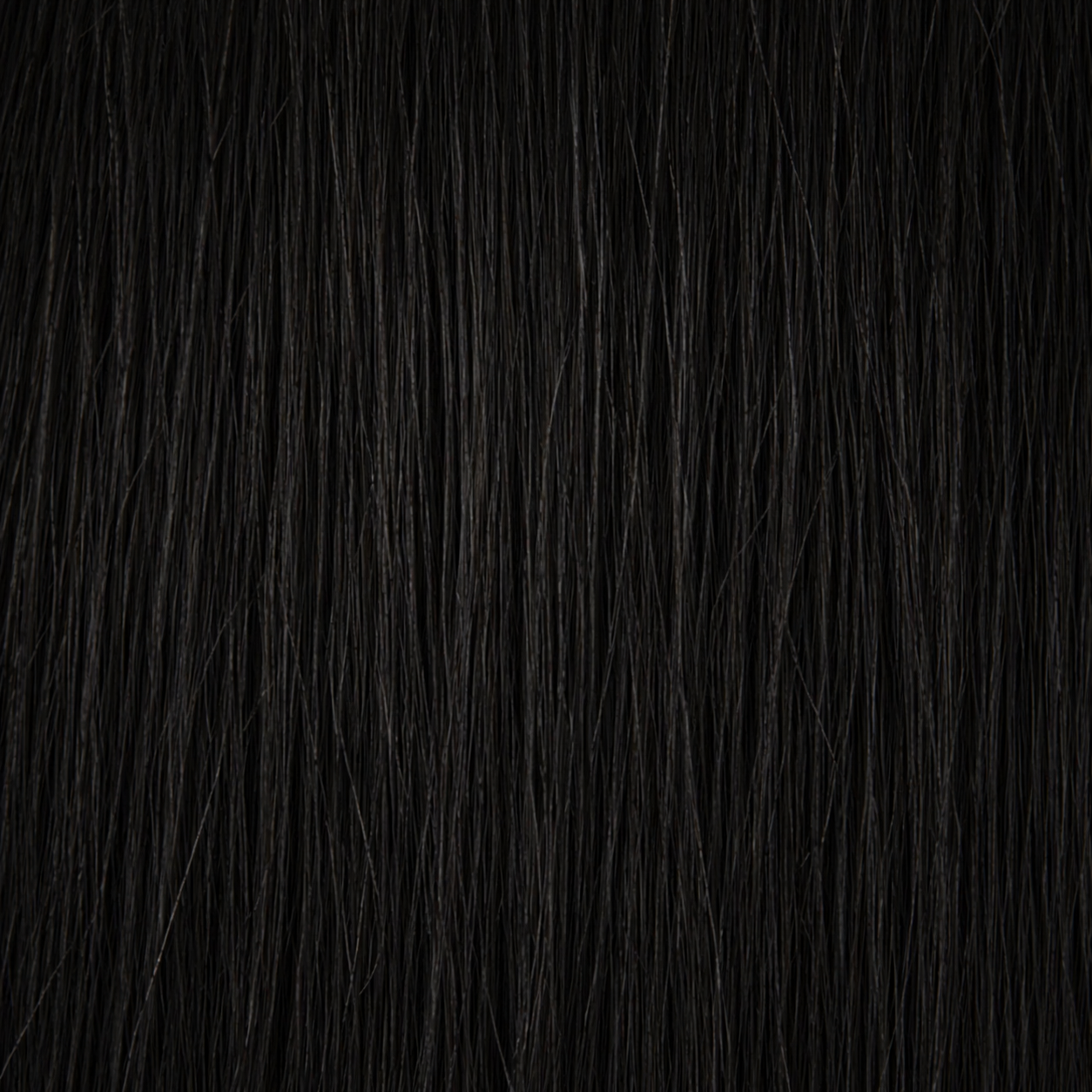 Primo piano della struttura dei capelli Remy nel colore #1 Nero corvino