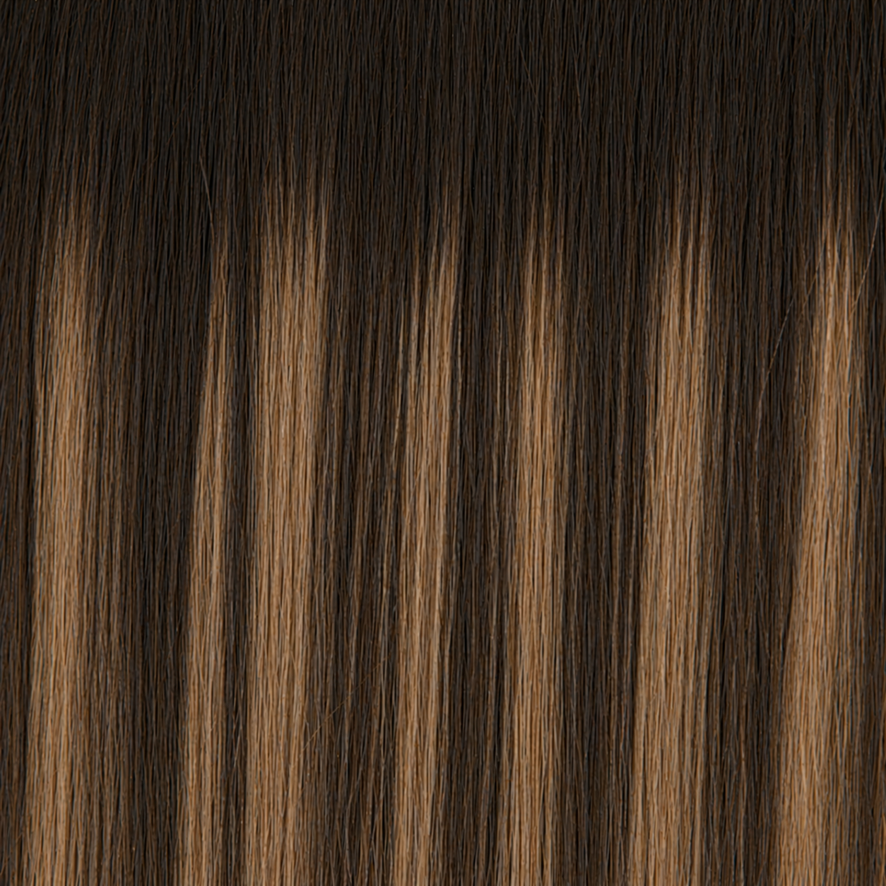 Close-up of the Remy human hair texture in shade #3/3T24 Balayage